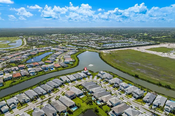 an aerial view of a house with garden space and outdoor seating