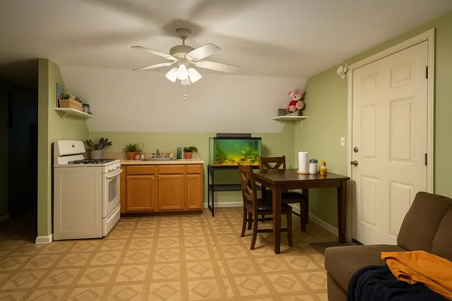 a view of a dining room with furniture and chandelier