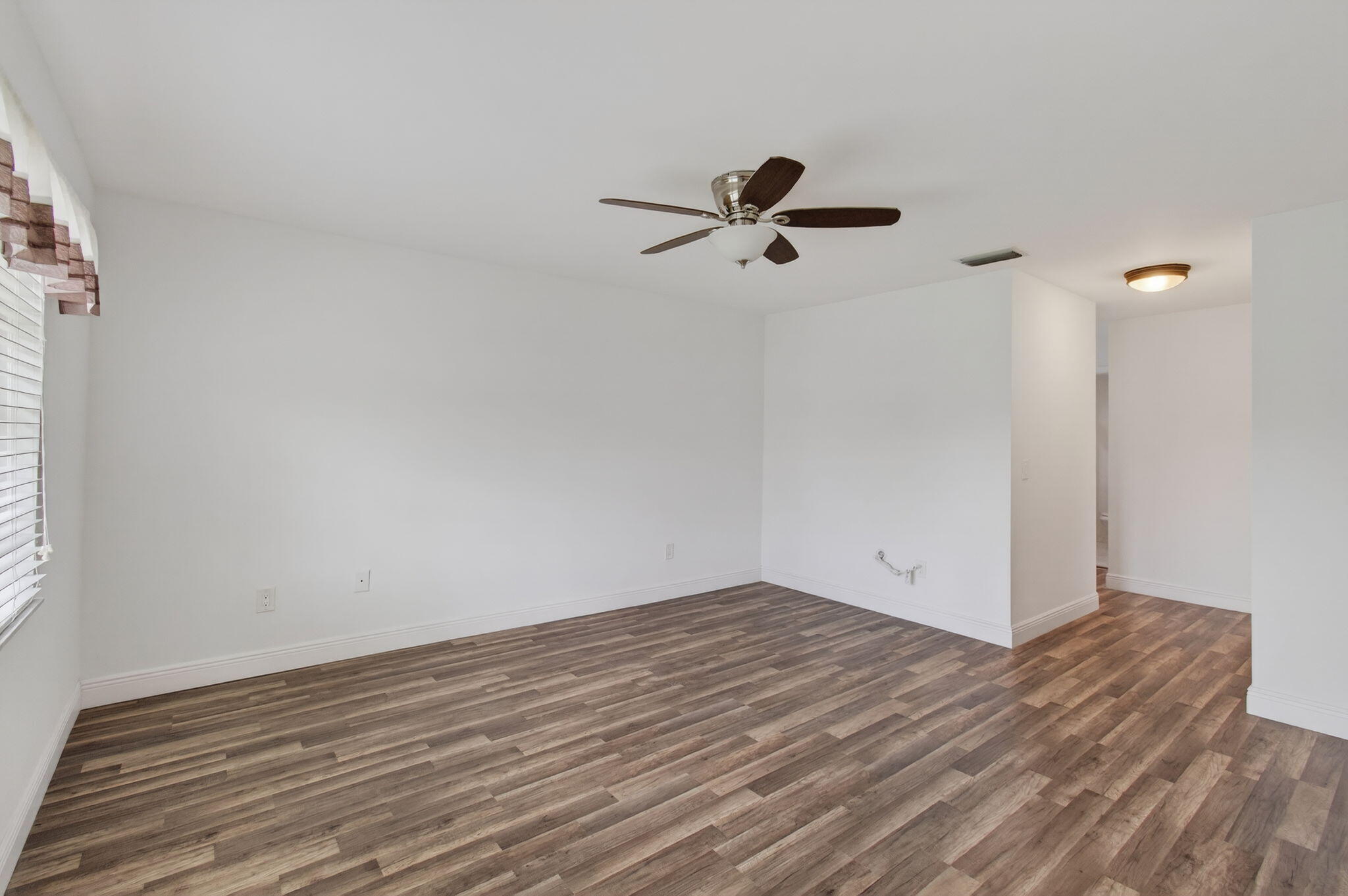 8536 Casa Del Lago, Unit 49B Boca Raton, FL 33433 - Photo 29 of 79 a view of a big room with wooden floor and windows