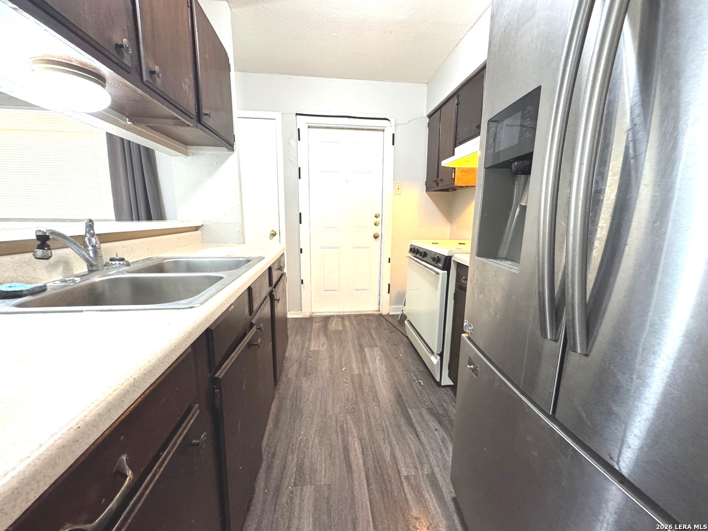 7300 Deep Spring Drive San Antonio, TX 78238 - Photo 5 of 9 a kitchen with stainless steel appliances granite countertop a refrigerator and a sink