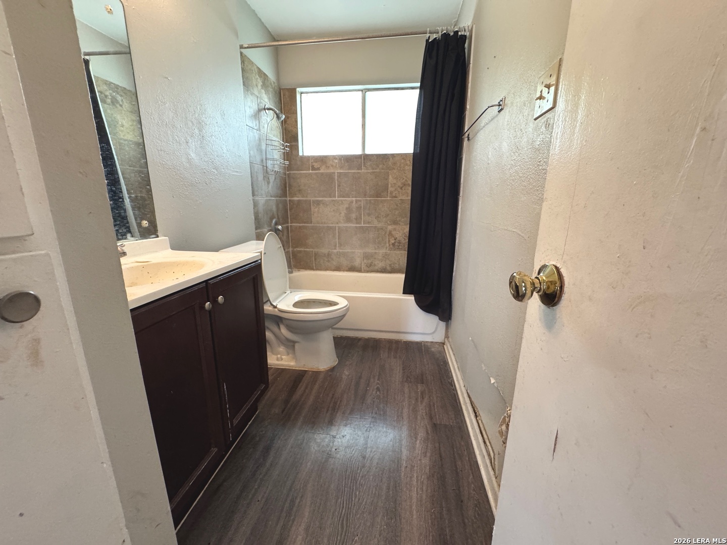 7300 Deep Spring Drive San Antonio, TX 78238 - Photo 6 of 9 a bathroom with a sink a toilet a window and shower