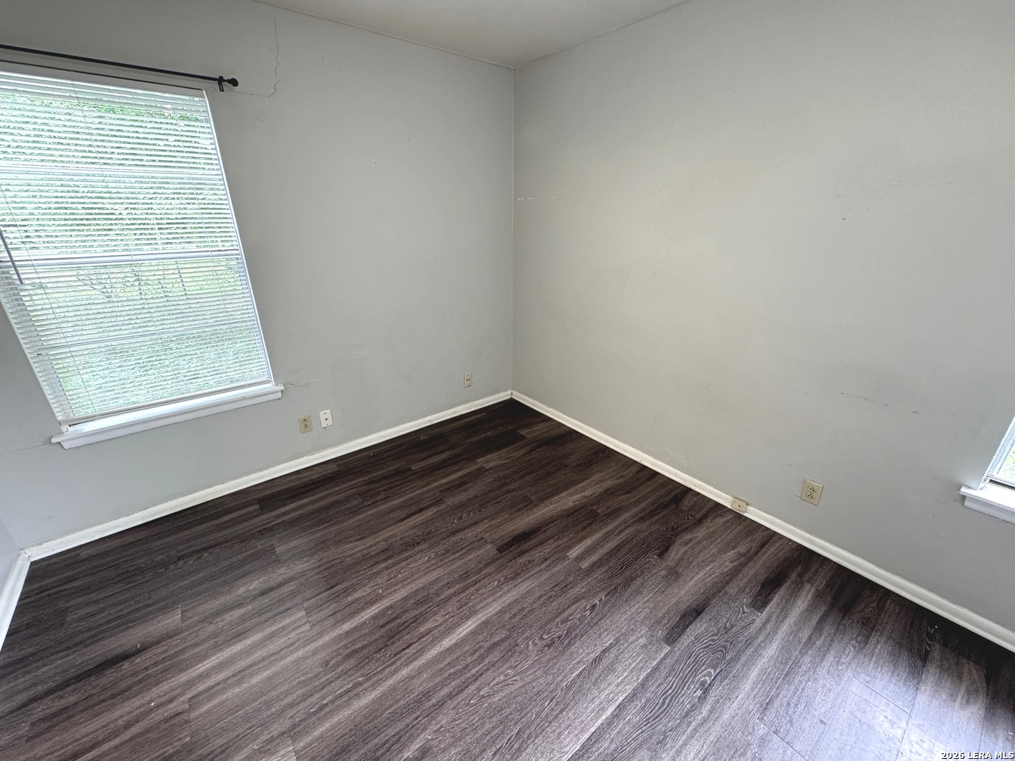 7300 Deep Spring Drive San Antonio, TX 78238 - Photo 7 of 9 a view of a room with wooden floor and small window