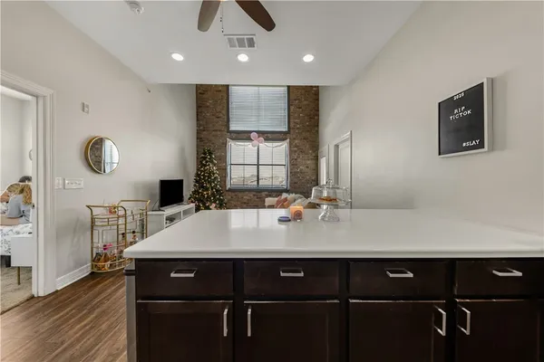a view of a center island table and living room