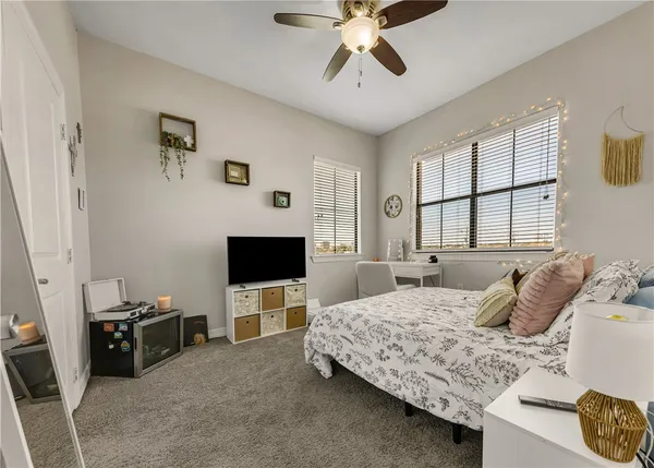 a bedroom with a bed and flat screen tv