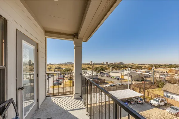 a view of a balcony with city view