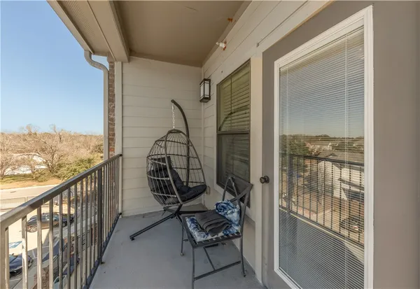 a view of a balcony with chair