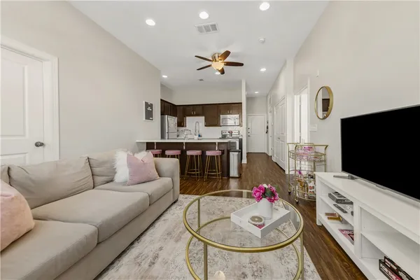 a living room with furniture and a flat screen tv