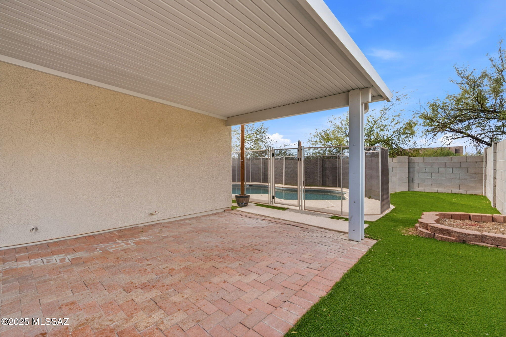 8244 South Lost Mountain Road Tucson, AZ 85747 - Photo 36 of 41 a view of a house with backyard and a garden