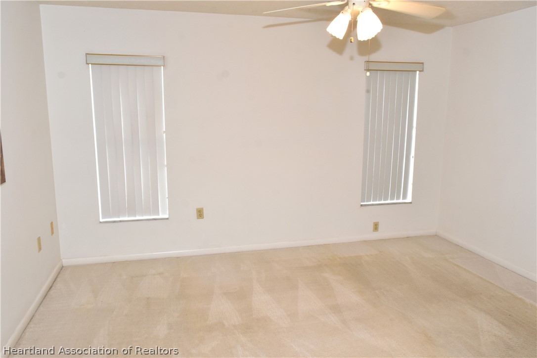 113 Longview Road Sebring, FL 33870 - Photo 13 of 31 an empty room with a window