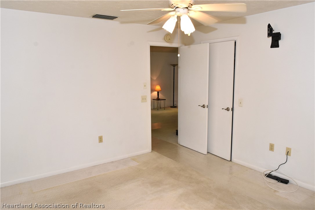 113 Longview Road Sebring, FL 33870 - Photo 14 of 31 wooden floor in an empty room