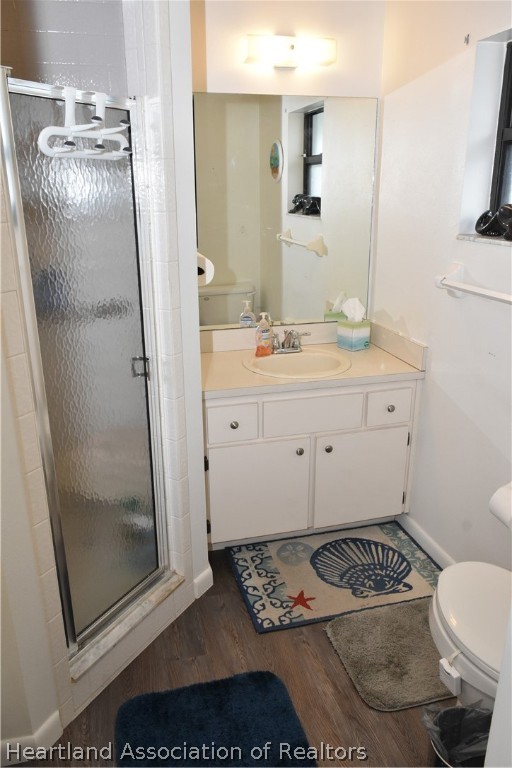 113 Longview Road Sebring, FL 33870 - Photo 15 of 31 a bathroom with a granite countertop sink a toilet a mirror and shower