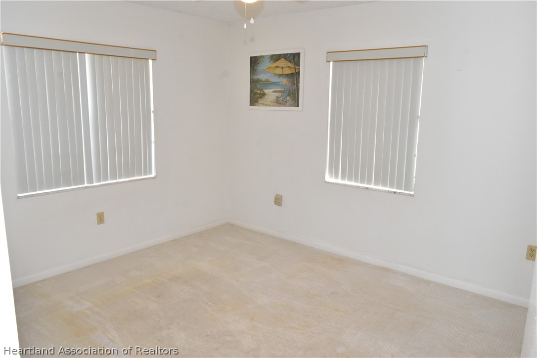 113 Longview Road Sebring, FL 33870 - Photo 17 of 31 an empty room with windows