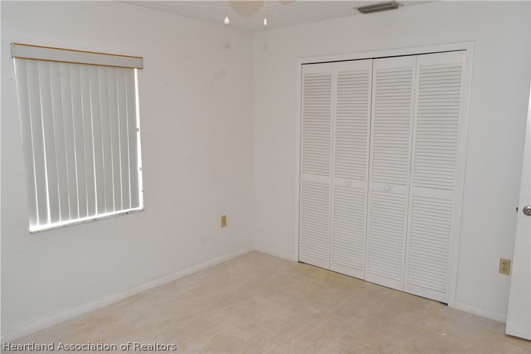 113 Longview Road Sebring, FL 33870 - Photo 18 of 31 an empty room with a window