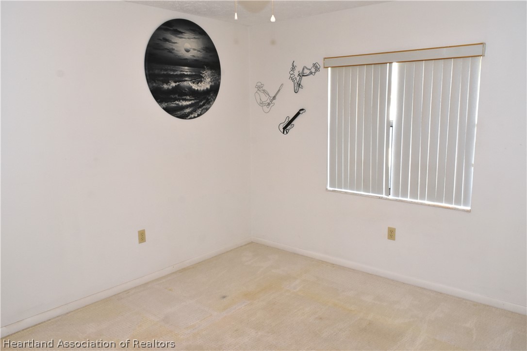 113 Longview Road Sebring, FL 33870 - Photo 19 of 31 an empty room with a window