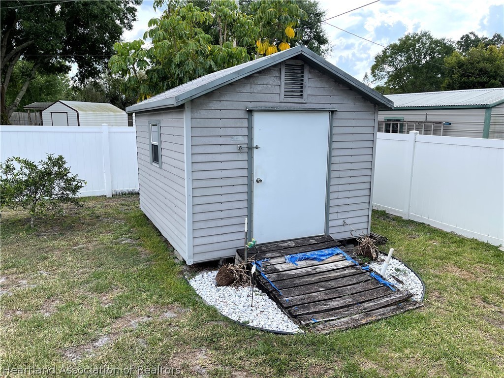 113 Longview Road Sebring, FL 33870 - Photo 27 of 31 a front view of a house with a yard