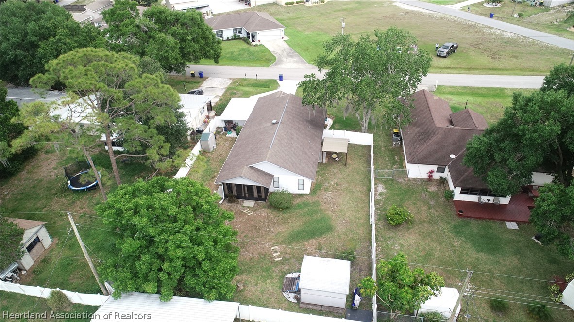 113 Longview Road Sebring, FL 33870 - Photo 28 of 31 an aerial view of a house with outdoor space patio and trees all around