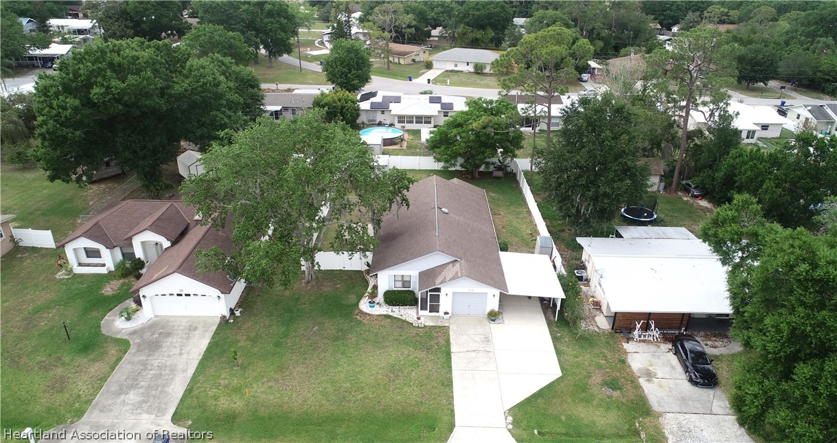 113 Longview Road Sebring, FL 33870 - Photo 30 of 31 an aerial view of a house with swimming pool and outdoor seating
