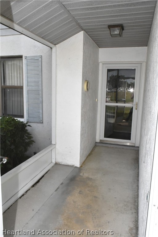 113 Longview Road Sebring, FL 33870 - Photo 3 of 31 a view of a hallway with wooden floor and entryway