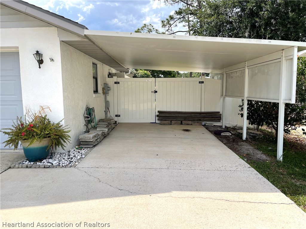 113 Longview Road Sebring, FL 33870 - Photo 31 of 31 a view of a backyard with potted plants