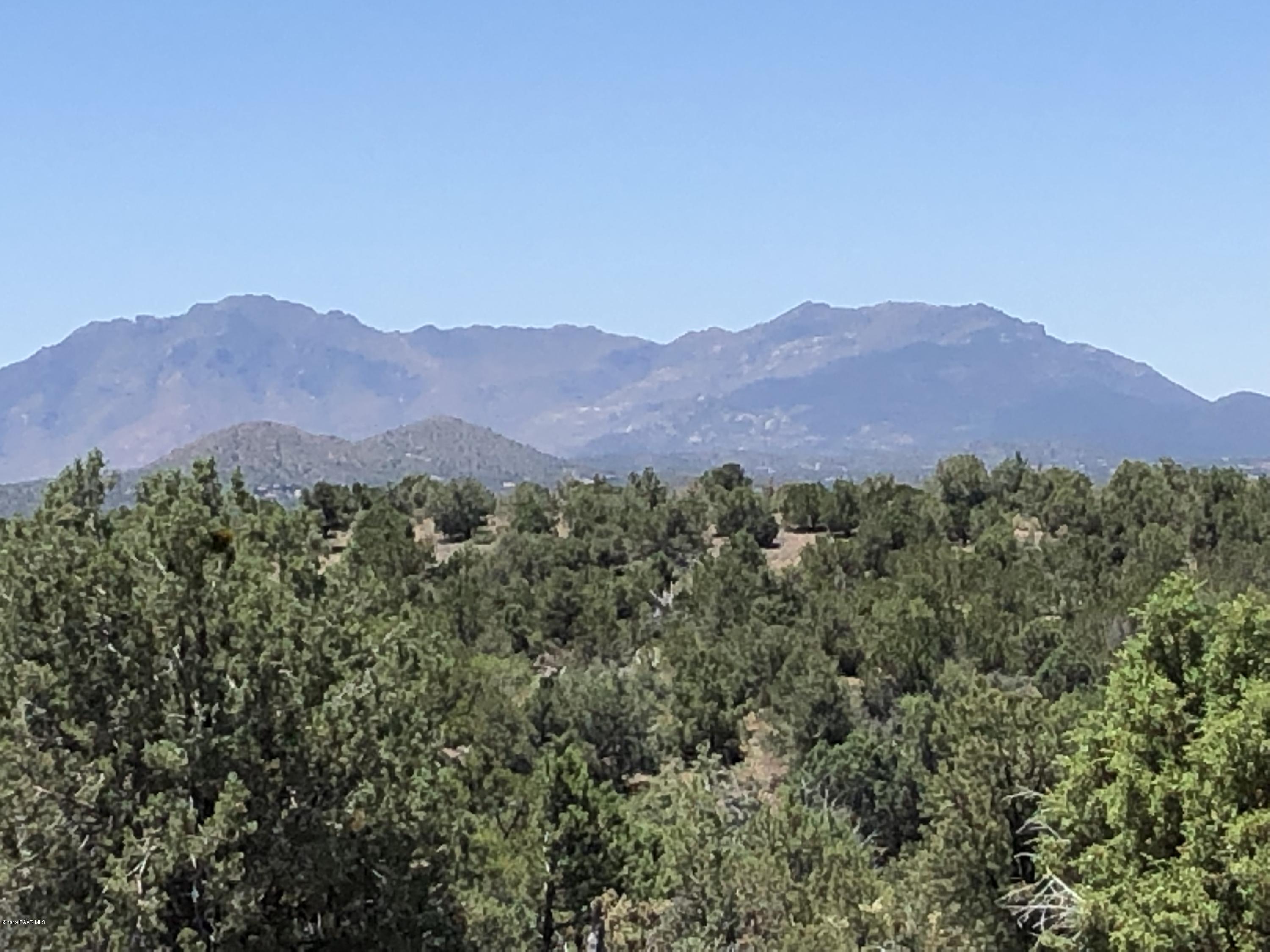 18700 Butte Pass Road Prescott, AZ 86305 - Photo 20 of 43 a view of a lush green hillside and a mountain