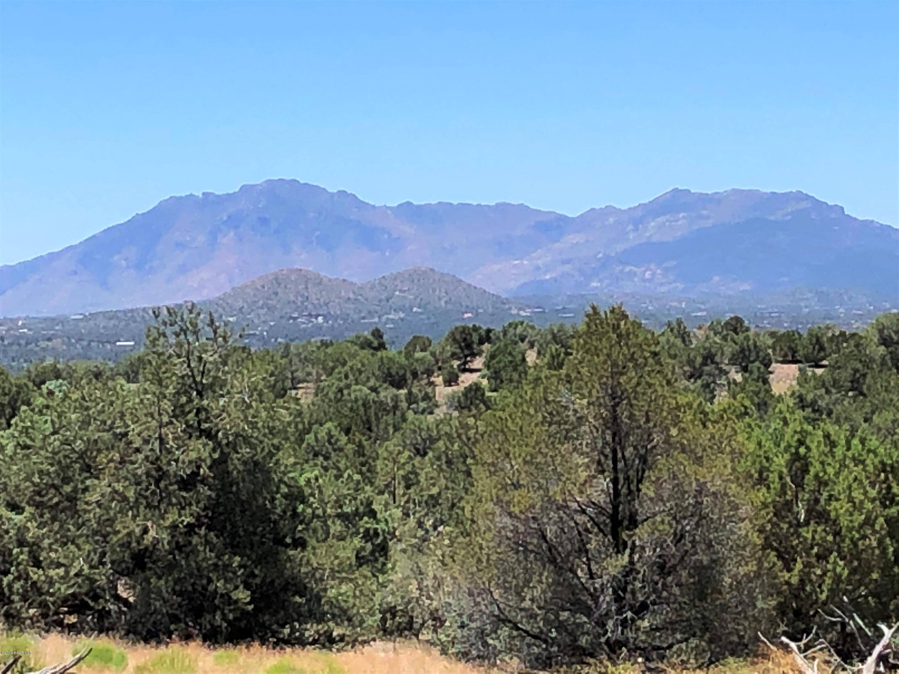 18700 Butte Pass Road Prescott, AZ 86305 - Photo 3 of 43 a view of a lush green hillside and a mountain