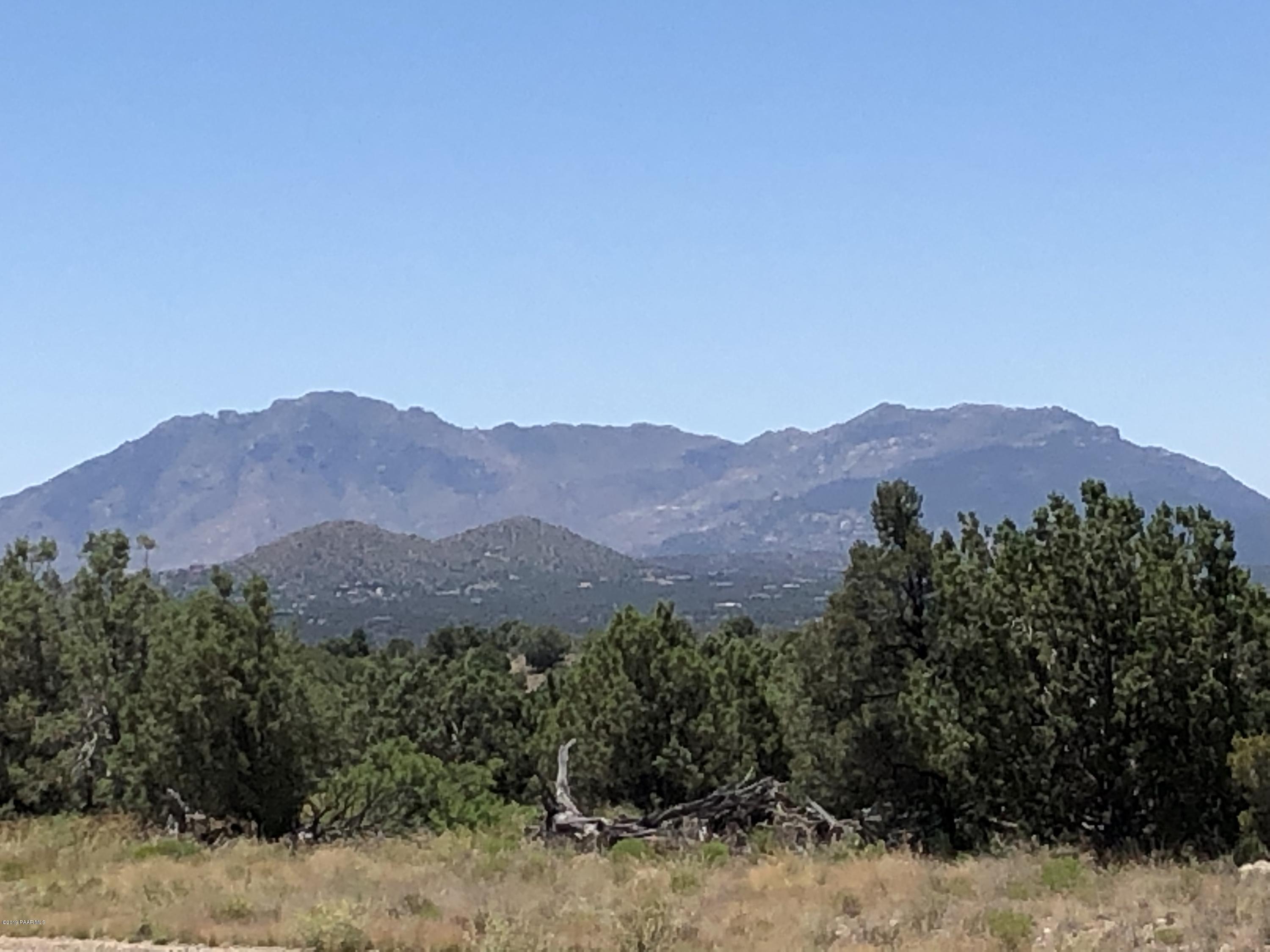 18700 Butte Pass Road Prescott, AZ 86305 - Photo 39 of 43 a view of a mountain range with a lush green forest