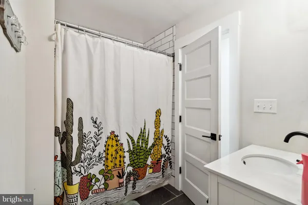 a bathroom with a bathtub and shower