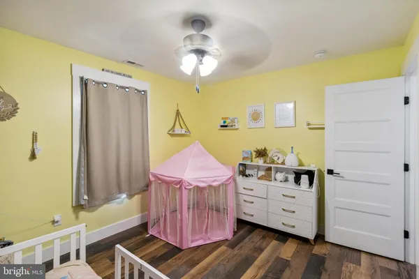 a bathroom with a tub shower and sink