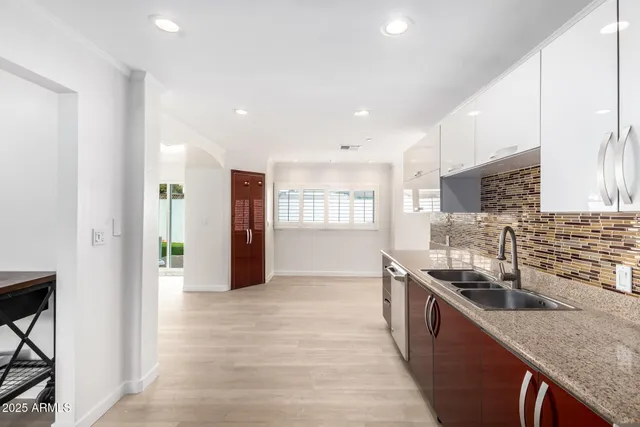 a bathroom with a toilet sink shower and mirror