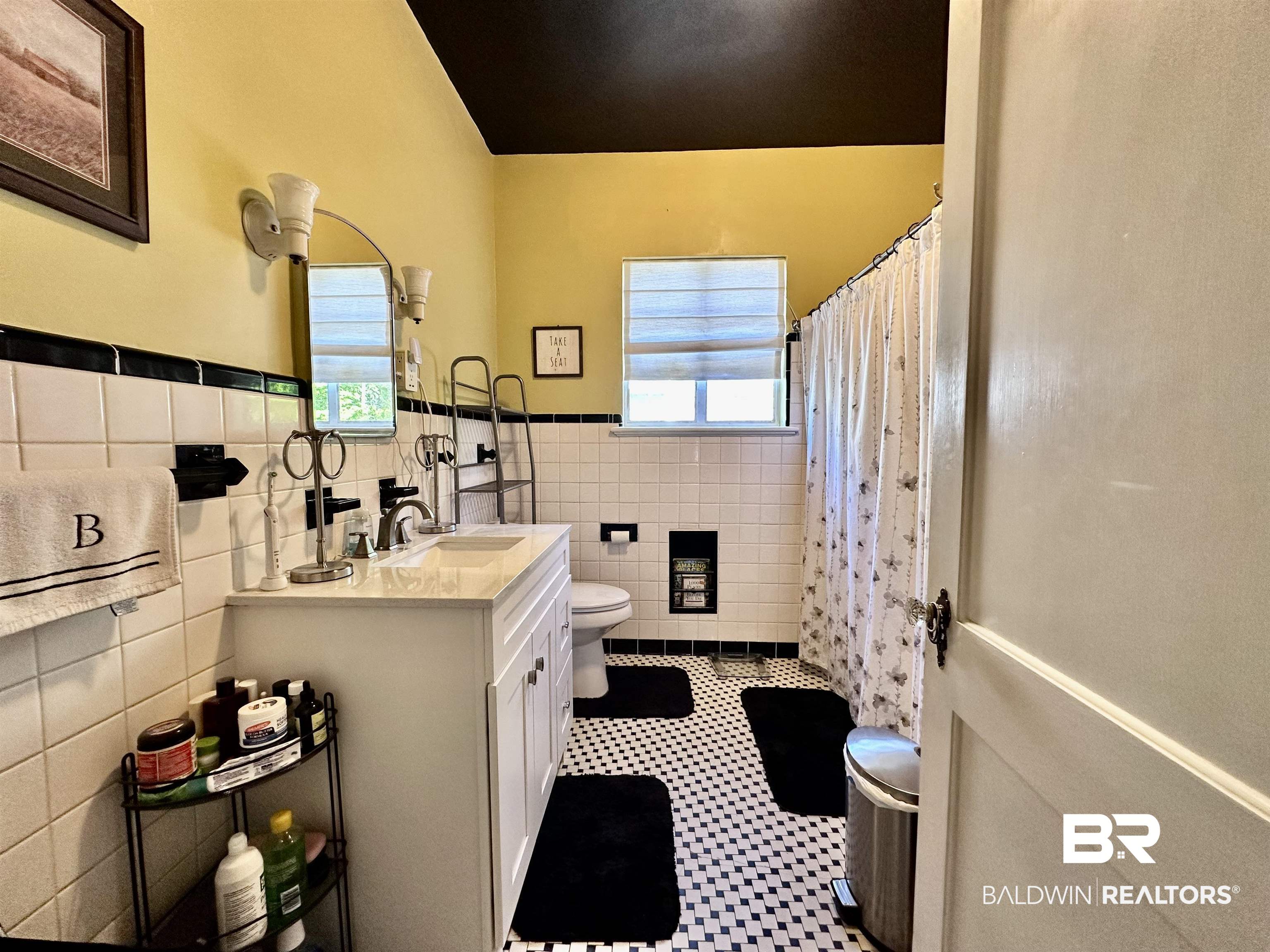 260 Siena Vista Street Mobile, AL 36607 - Photo 13 of 41 Full bath with toilet, tile walls, vanity, wainscoting, and healthy amount of natural light