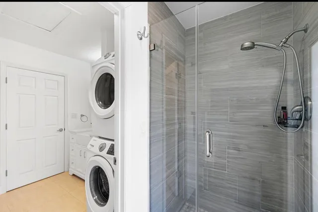 a bathroom with a sink a washer and dryer