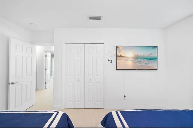 a view of room with wooden floor