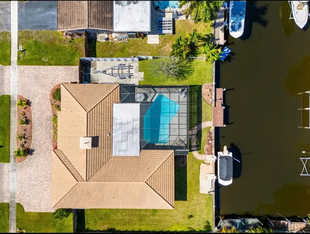 an aerial view of a house with swimming pool