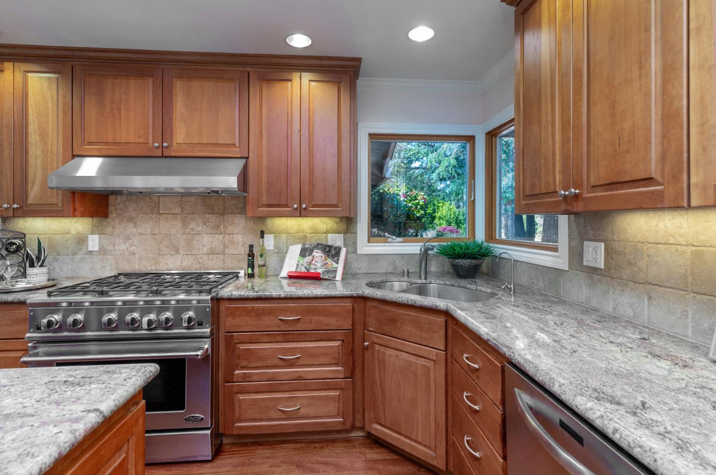 14920 Jerries Drive Saratoga, CA 95070 - Photo 12 of 34 a kitchen with granite countertop a sink a counter space appliances and cabinets
