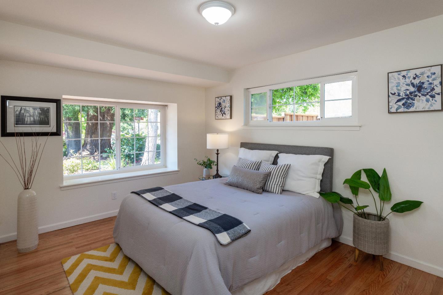 14920 Jerries Drive Saratoga, CA 95070 - Photo 18 of 34 a bedroom with bed window and wooden floor