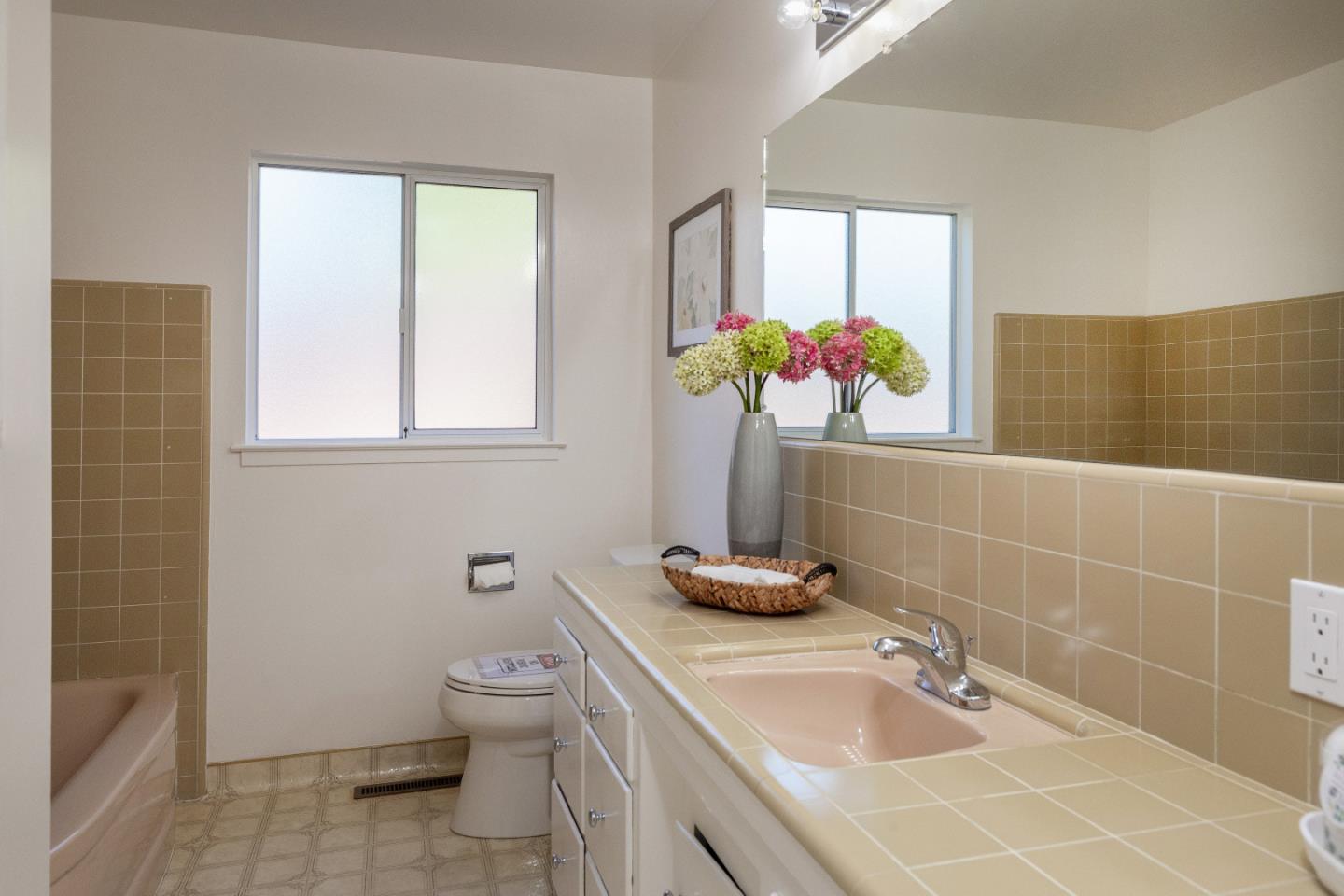 14920 Jerries Drive Saratoga, CA 95070 - Photo 19 of 34 a bathroom with a sink a toilet and a mirror