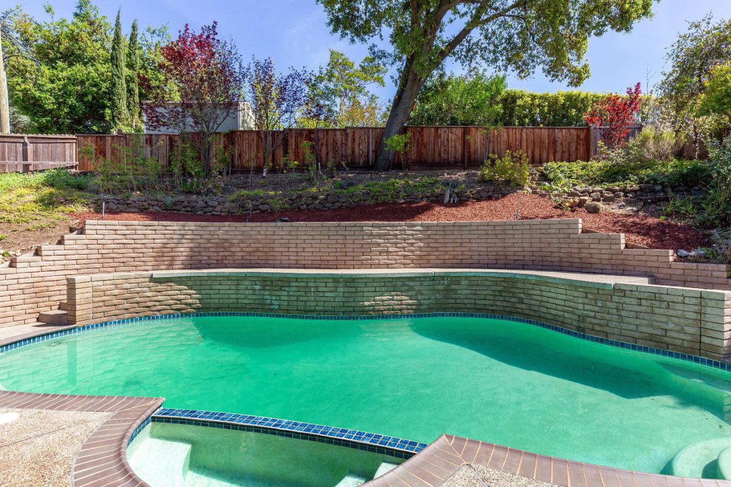 14920 Jerries Drive Saratoga, CA 95070 - Photo 29 of 34 a view of a backyard with a garden and entertaining space