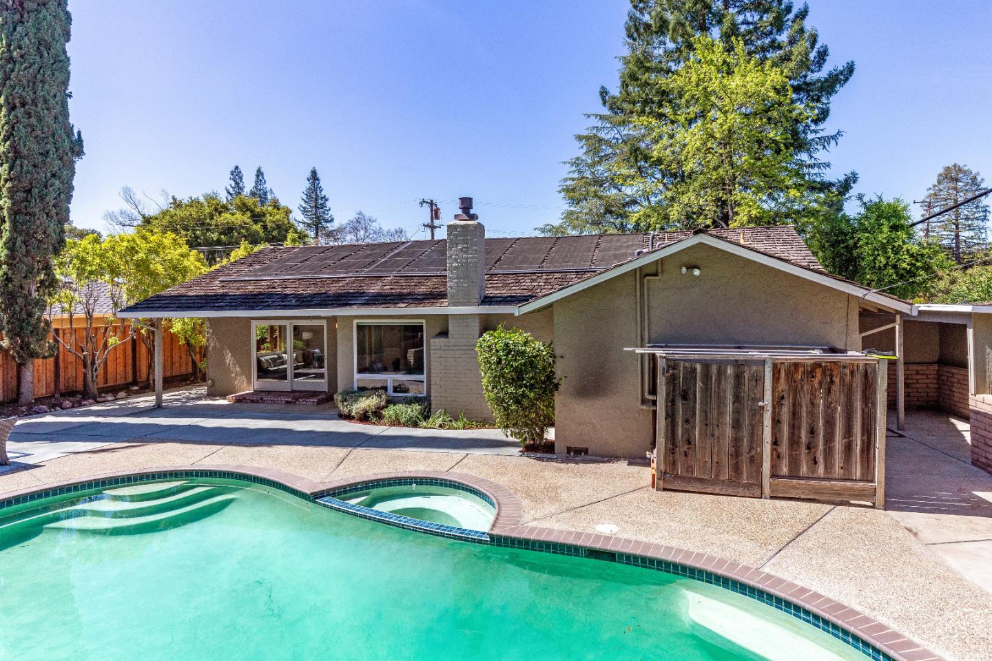 14920 Jerries Drive Saratoga, CA 95070 - Photo 31 of 34 a view of a house with swimming pool and a yard