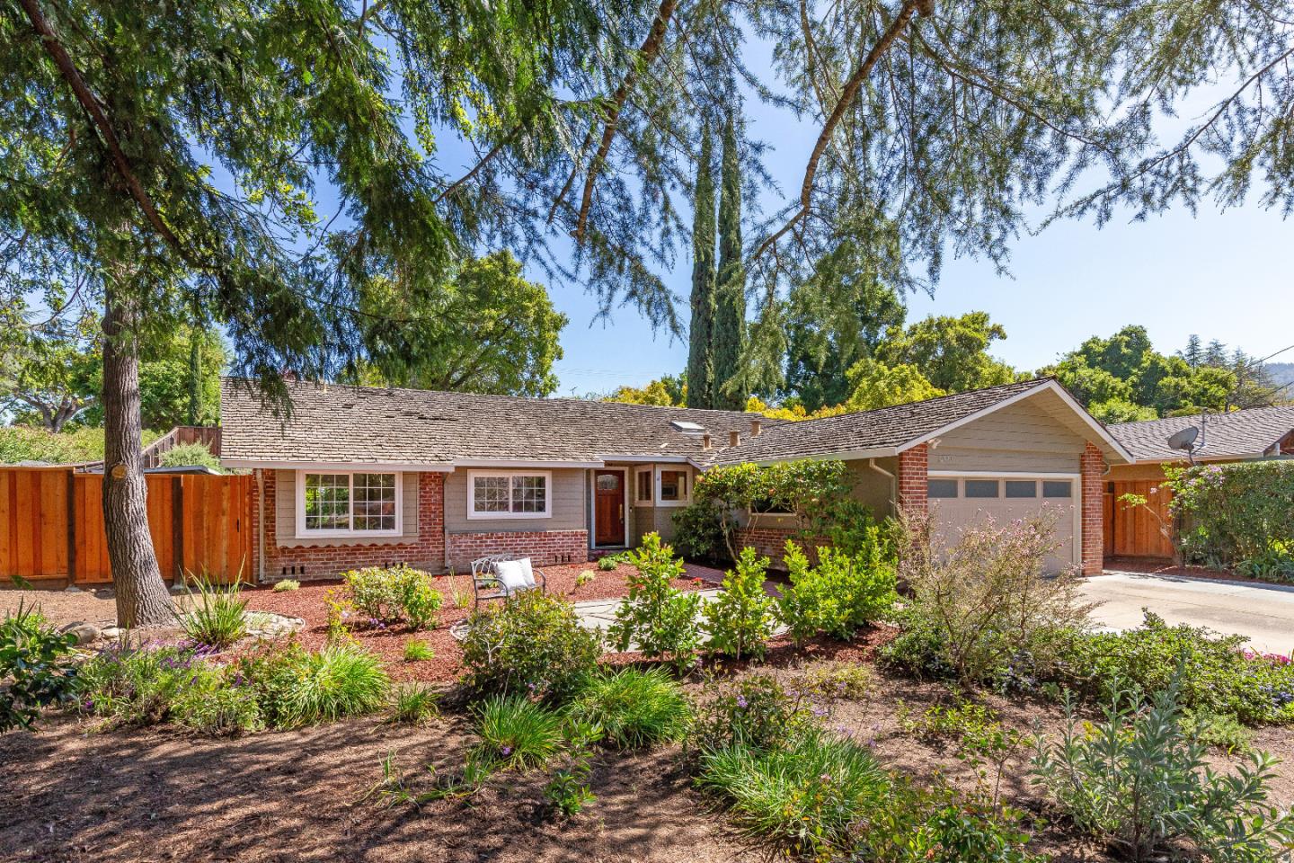 14920 Jerries Drive Saratoga, CA 95070 - Photo 5 of 34 a front view of a house with garden