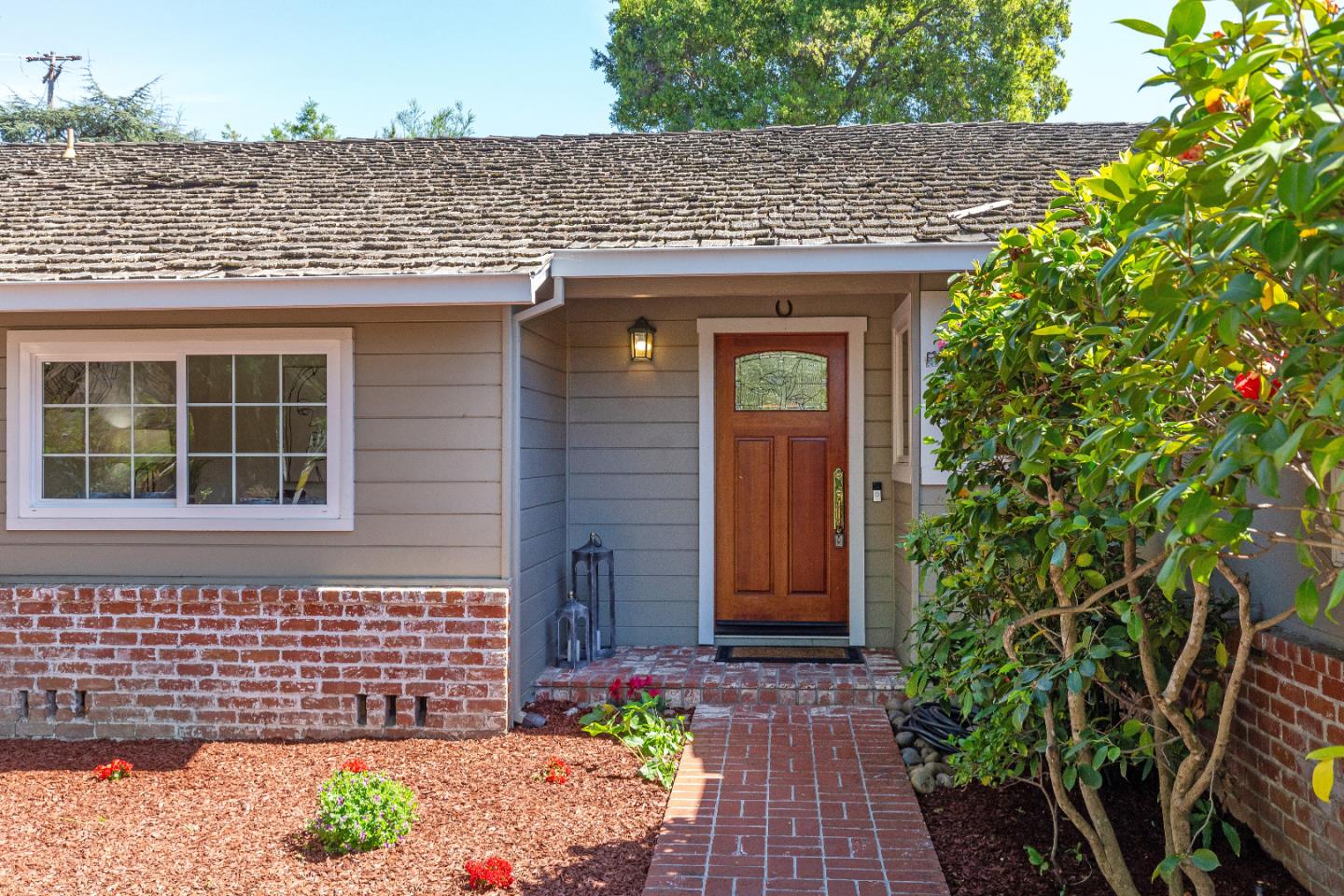 14920 Jerries Drive Saratoga, CA 95070 - Photo 6 of 34 a front view of a house with a garden