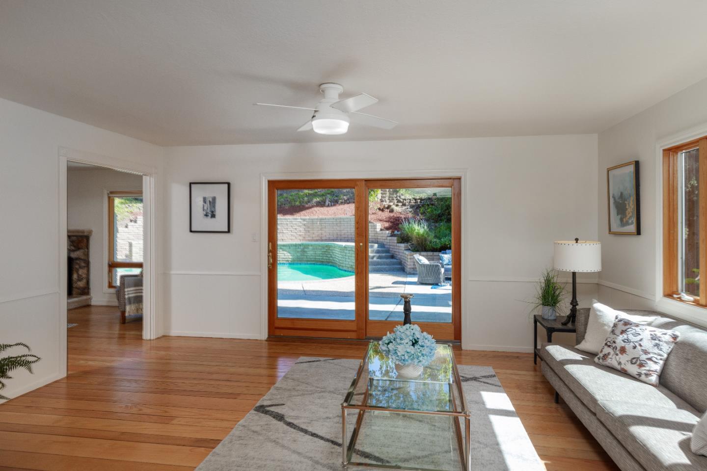 14920 Jerries Drive Saratoga, CA 95070 - Photo 10 of 34 a living room with furniture and a floor to ceiling window