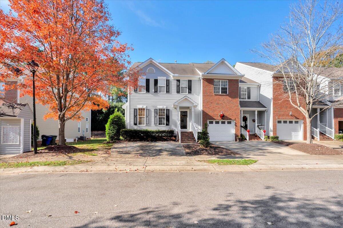6021 Four Townes Lane Raleigh, NC 27616 - Photo 2 of 49 a view of a white house with a large tree in front of it