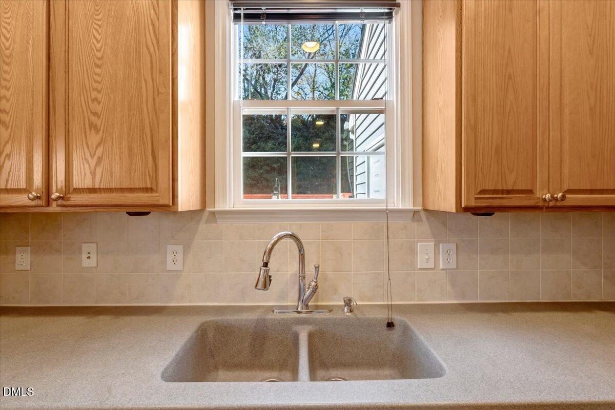 6021 Four Townes Lane Raleigh, NC 27616 - Photo 25 of 49 a close view of sink and tap