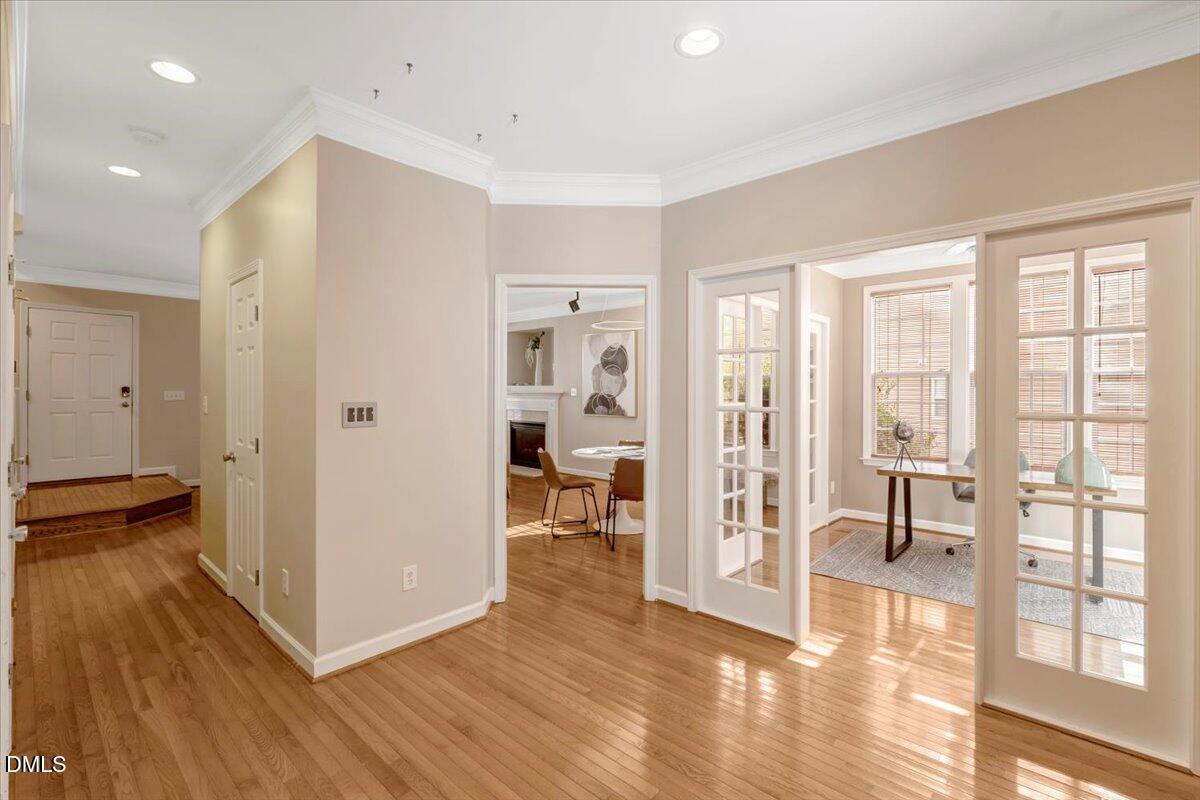 6021 Four Townes Lane Raleigh, NC 27616 - Photo 26 of 49 a view of a livingroom with wooden floor and a kitchen