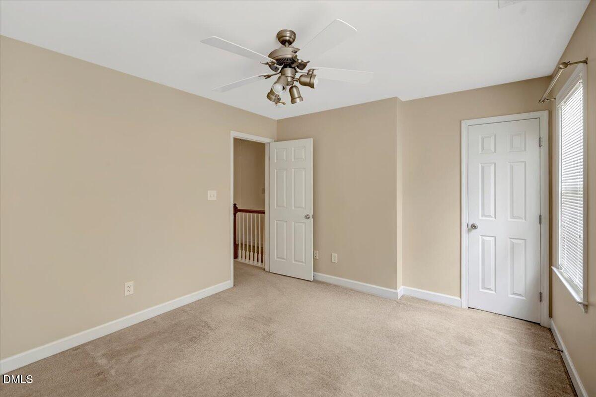 6021 Four Townes Lane Raleigh, NC 27616 - Photo 29 of 49 a view of an empty room and a ceiling fan