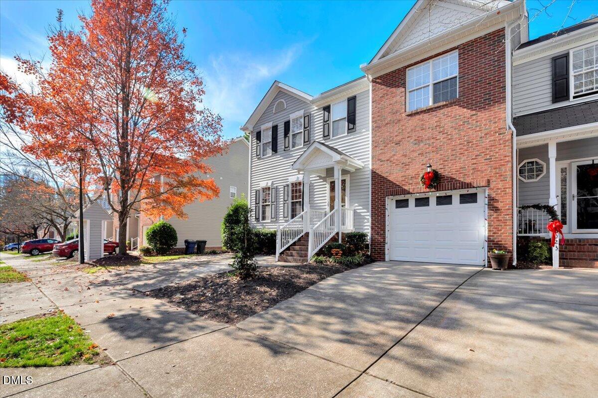 6021 Four Townes Lane Raleigh, NC 27616 - Photo 3 of 49 a view of a building with a bench in front of house