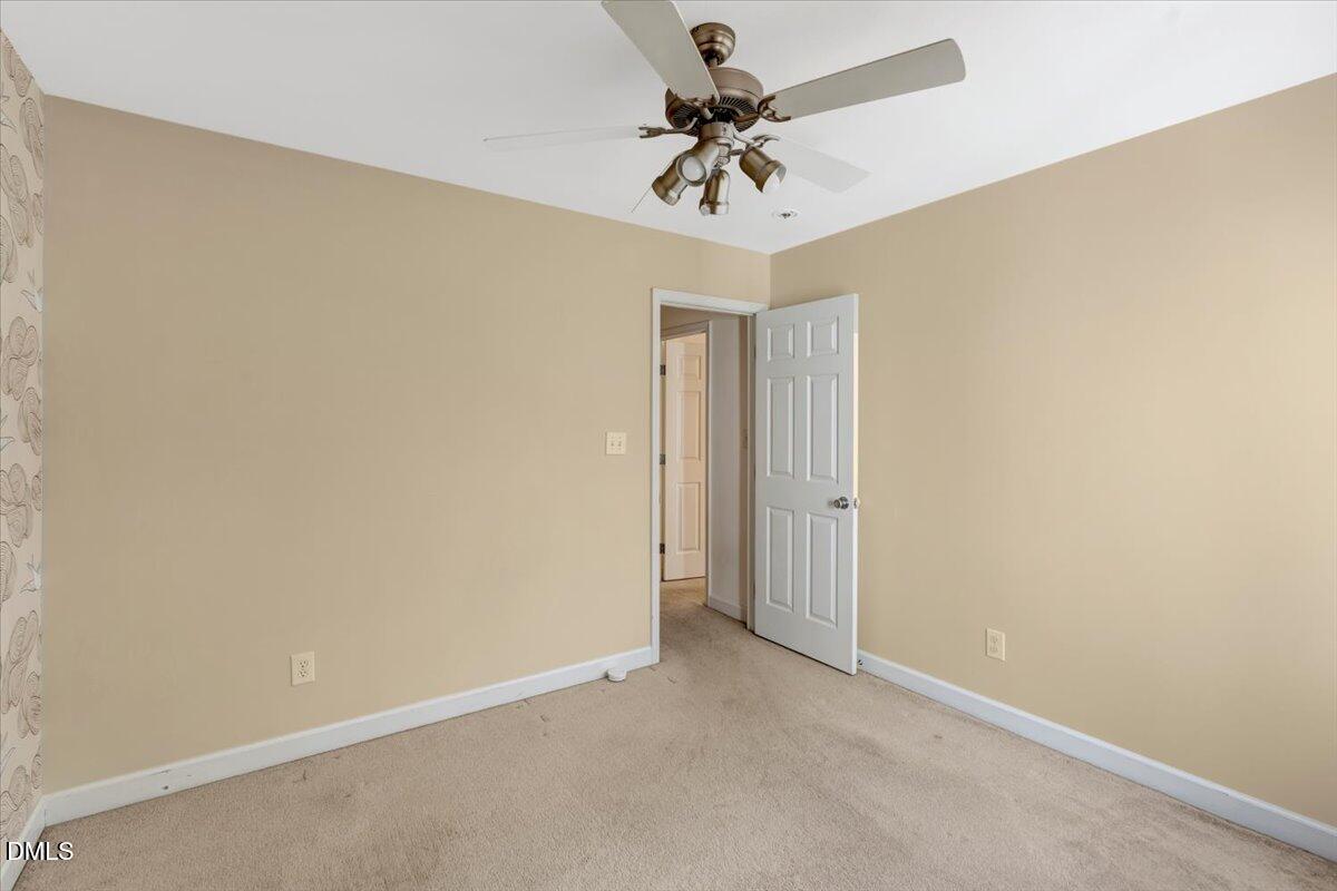 6021 Four Townes Lane Raleigh, NC 27616 - Photo 35 of 49 an empty room with a ceiling fan and a fan
