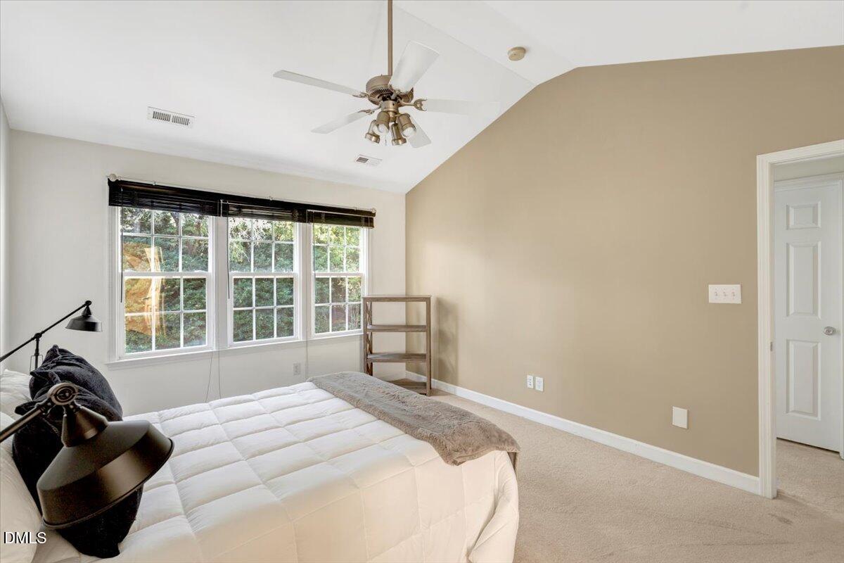 6021 Four Townes Lane Raleigh, NC 27616 - Photo 39 of 49 a bedroom with a bed and a large window