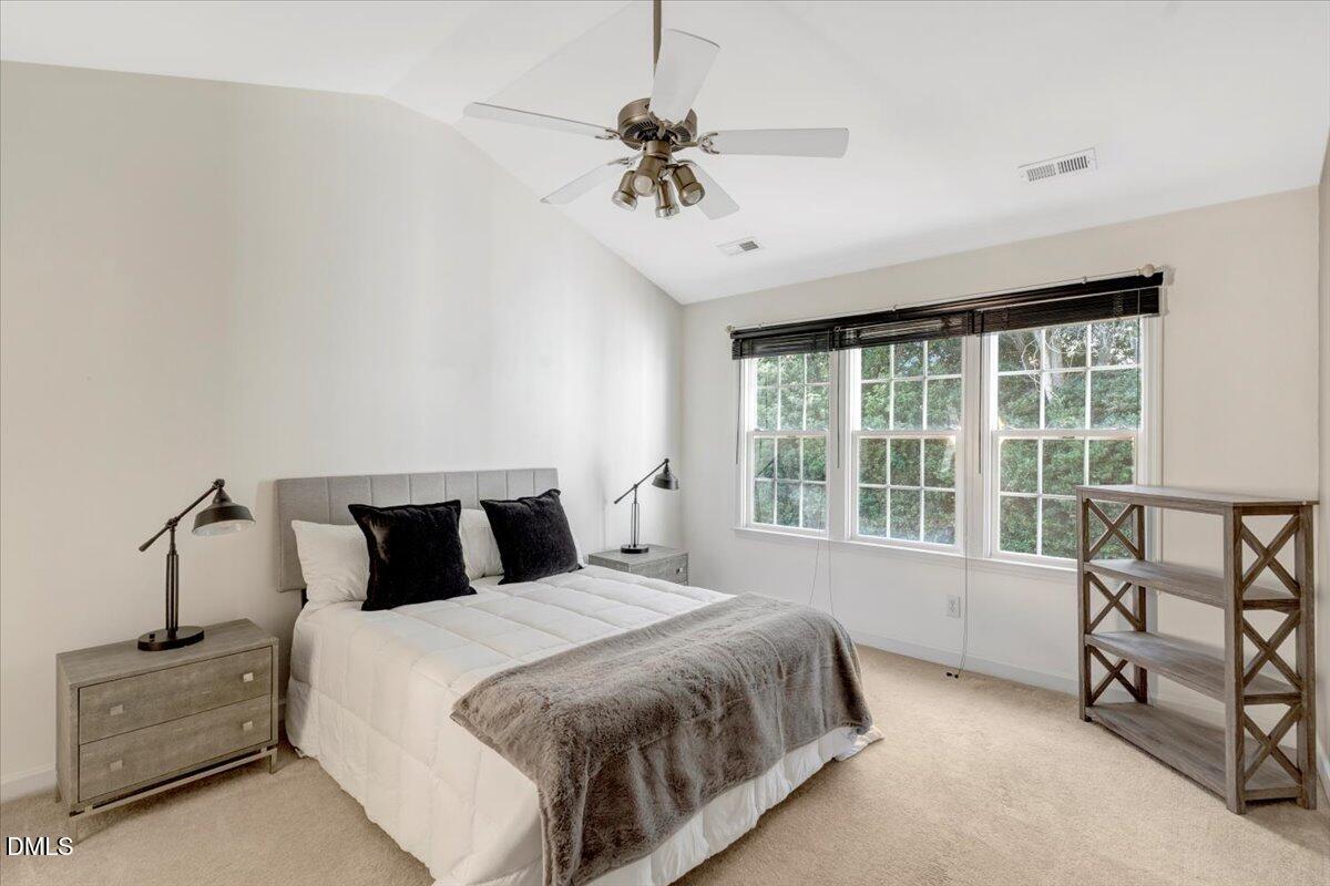 6021 Four Townes Lane Raleigh, NC 27616 - Photo 41 of 49 a bedroom with a bed and a balcony