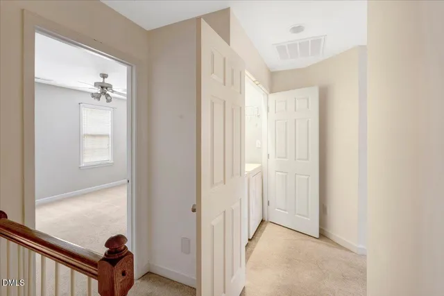 a view of a hallway view with staircase